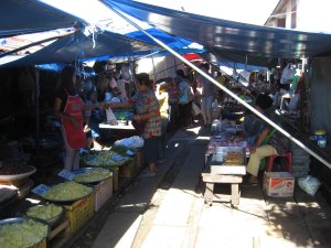 Under the awnings of the train market