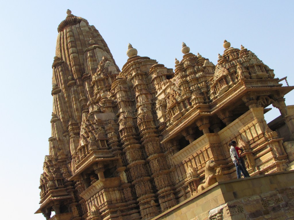 Main temple in western complex of temples in Khajuraho, built 1000 years ago. These temples are famous for some erotic carvings they have on the outside walls, as well as for exquisite workmanship.