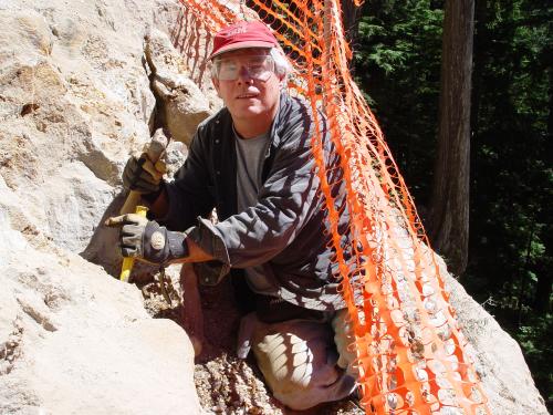 Me chiseling quartz crystals and large fool's gold cubes on Spruce Mountain near Seattle